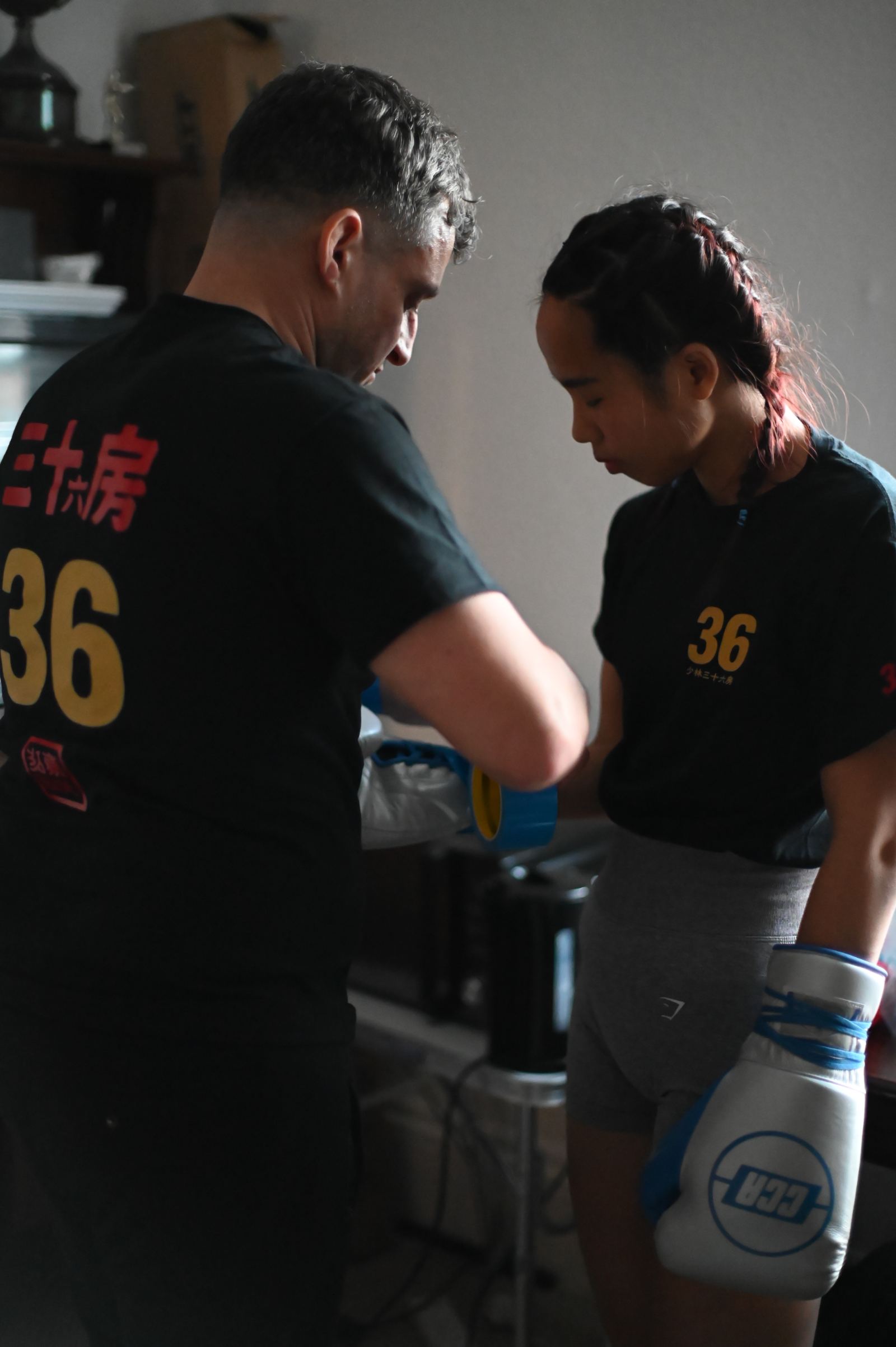 Coach wrapping hands before a fight
